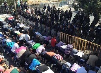 AQSA RESTRICTIONS FORCE THOUSANDS INTO JERUSALEM STREETS FOR PRAYER