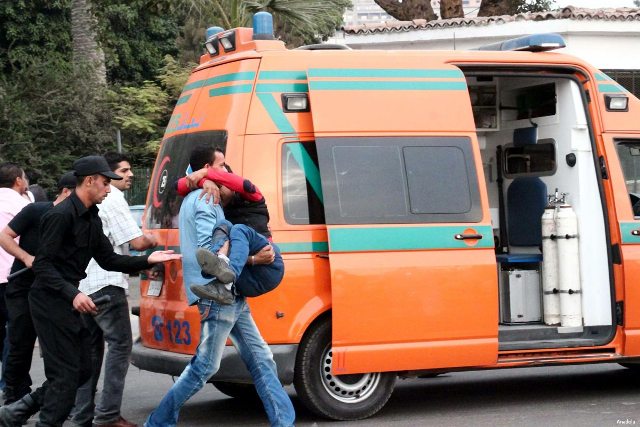 egypt-cairo-bomb-blast-october-2014-injured-being-carried-to-ambulance