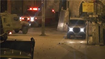 ZIONIST TROOPS RAID WEST BANK AND SHOOT TEENAGER