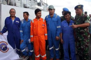 Five Indonesian sailors who survived an attempted hijacking arrive in Tarakan, Kalimanatan, on April 23. EPA Photo.