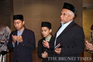 Irma Mohammad Hazmie Hj Matussin (L) and Muhammad Aqiel Hidayat Hj Zulfa Hidayat (C) returned from a Quran memorisation competition in Jakarta yesterday.