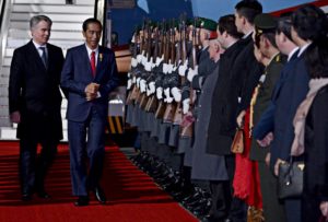 President Joko Widodo inspects guards shortly after he arrived in Berlin for a one-day work visit on Sunday evening local time.