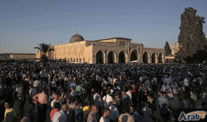 The atmosphere during the Friday prayer at Al-Aqsa Mosque. Worshipers spilling up to the grounds of the mosque..