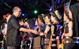 Datuk Seri Dr Salleh Tun Said greets participants for the Kadazan Dusun Unduk Nagadau Harvest Festival celebration organised by the Kota Kinabalu City Hall in Padang City.