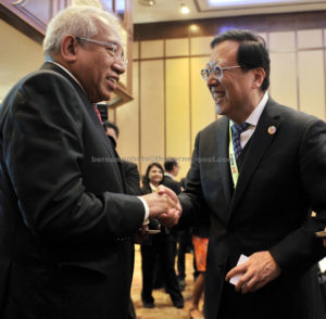 Mahdzir (left) shaking hands with Hao Ping after chairing the 9th Asean Education Ministers Meeting