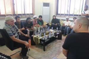Retired Army General Kivlan Zein (L) and Tarhata Misuari (in abaya) with freed Indonesian sailors –(L, seated next to each other on the couch) Mochammad Ariyanto Mijnan, Lorens Peter, Dede Irfan Hilmi, and Samsir – at the house of Sulu Gov. Totoh Tan. 