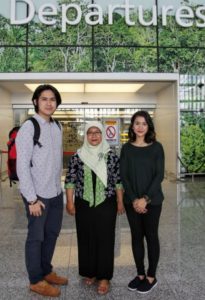 Shinta Hapsari (C), first secretary at the Embassy of Indonesia, with UBD students who received the Indonesian Arts and Culture Scholarship, Mohammad Qawi (L) and Nurhasanah.