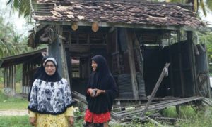 Yawahee Wae-mano (left) and her daughters roam the grounds of the Jihad Witaya School in Deep South for the last time before moving, Feb. 15, 2016.