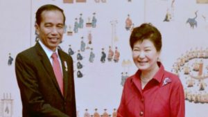 Indonesia's President Joko Widodo shakes hands with his South Korean counterpart Park Geun-hye on Monday .