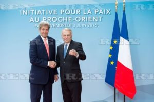 French Foreign minister Jean-Marc Ayrault shakes hands with US Secretary of State John Kerry .