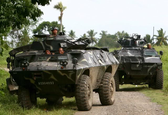 Philippine military in Simba tanks enter a village for clearing operations in Southern Philippines.