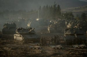 Israeli tanks and APC’s gather by the Israeli – Lebanese border. Amid Israel’s escalating campaign against Hezbollah in Lebanon on September 30, 2024. [Erik Marmor/Getty Images]