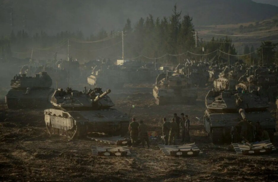 Israeli tanks and APC’s gather by the Israeli – Lebanese border. Amid Israel’s escalating campaign against Hezbollah in Lebanon on September 30, 2024. [Erik Marmor/Getty Images]