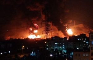 A fire engulfs an oil refinery in Haifa City, Israel after being hit by an Iranian missile, Saturday night, June 14, 2025. (Photo: @NavCom24 / X)