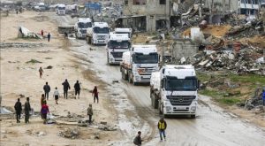 Trucks carrying aid (Photo by Ashraf Amra)