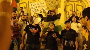 Aqsa Working Group (AWG) representative, Farid Al-Ayubi (center), delivers a speech at the Global Sumud Flotilla solidarity rally in Masroh Al-Baladi, downtown Tunisia, Sunday (August 31, 2025). [Doc. AWG]